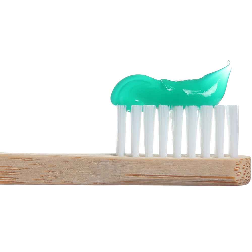 toothbrush with toothpaste to prevent cavities